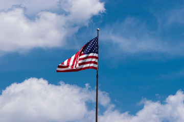 US flag folding over as it waves in the wind