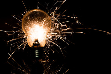 light bulb and sparkler in the dark