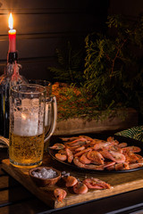  shrimp and a glass of beer in a pub
