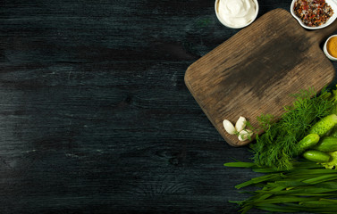 Sandwiches with vegetables. Fresh sandwiches with vegetables on a dark board on a textured background. View from above. Copy space