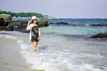Young asian woman having fun at tropical beach on vacation, Couple of asian girl walk on the beach with bright sun light, Samed island, Thailand, Chubby girl enjoying on the sea, Lifestyle concept