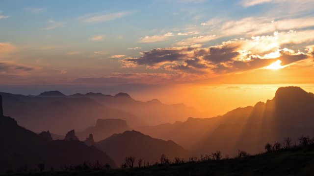 Day to night sunset hyper lapse over volcanic caldera of Tejeda, Gran Canaria, Canary islands, Spain.