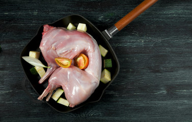 Fresh green zucchini on a dark table. The view from the top. Copy space.