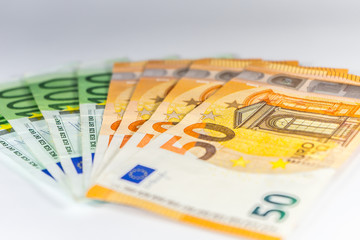 Close up on various Euro EUR banknotes on the table business and finance money wealth savings credit finance