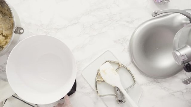 Step by step. Flat lay. Measuring cookie dought with a digital kitchen scale to bake red, white, and blue pinwheel sugar cookies.