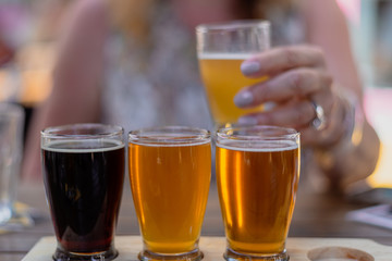 woman enjoying beer flight
