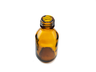 Amber semi-inclined small pharmaceutical empty glass bottle with no lid for mock-up or aromatherapy on white background