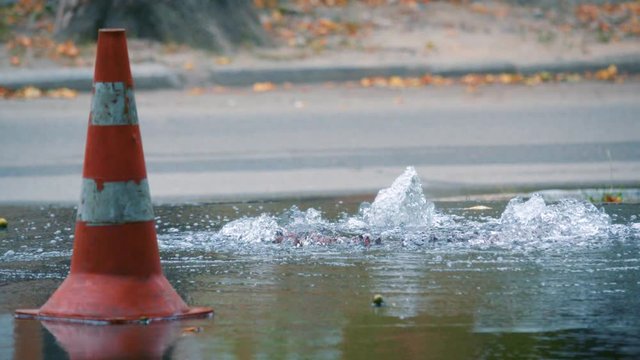 Breakthrough water pipe on the street. Accident of water supply, sewage.