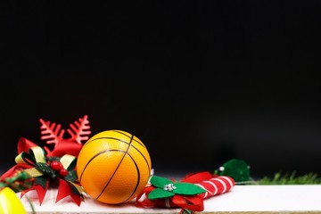 Basketball Christmas with basketball and Christmas snowflake are on black background.