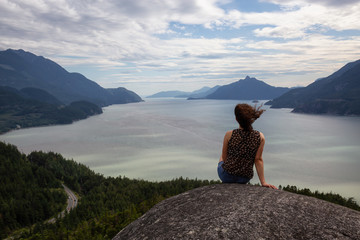 Adventurous Girl Hiking up a mountain during a vibrant summer day. Taken in Murrin Park near Squamish, North of Vancouver, BC, Canada.