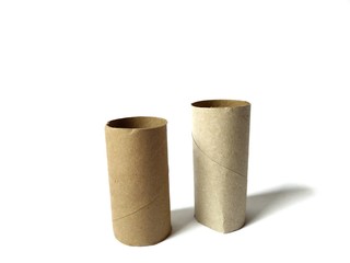 Empty toilet paper rolls on white background
