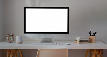 Blank screen desktop computer in minimal workplace