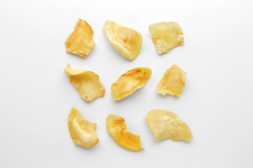 Crispy durian chips on a white background, creative flat lay food concept, top view with clipping path