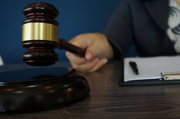 Legal counsel presents to the client a signed contract with gavel and legal law. justice and lawyer...
