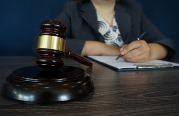 Legal counsel presents to the client a signed contract with gavel and legal law. justice and lawyer law of advisor Concepts