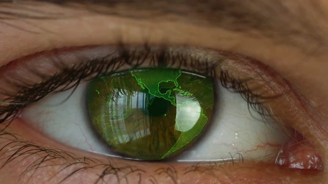 Close up to human eye with futuristic vision system . Digital rotating globe in man's eye. Concept of vision and control and protection.