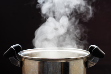 Selective focus steam over cooking pot.hot food