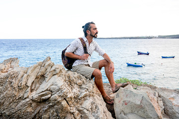 portrait of a young man at the beach  