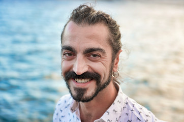 portrait of a young man at the beach  