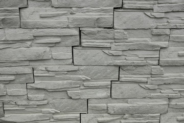 Facing tile stone wall texture background. light gray color