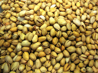 heap of many pistachios in the shell