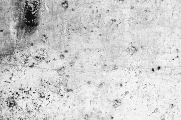 Texture of a concrete wall with cracks and scratches which can be used as a background