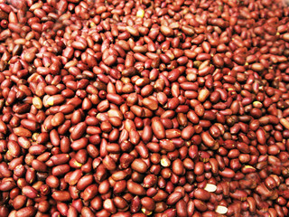 heap of many raw peeled peanuts