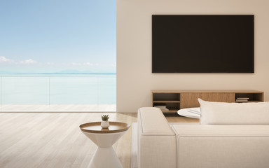 View of white living room in minimal style with wood cabinet on sea view background.Interior design with black screen of television on white wall,TV, 3D rendering.	