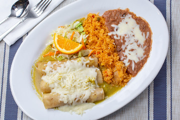 A top down view of an enchilada plate