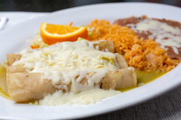 A closeup view of an enchilada plate