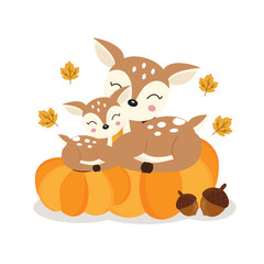 Cute deer mom and baby on pumkins in autumn.