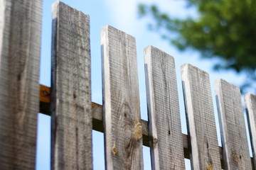 Wooden fence. Close up. Against the blue sky