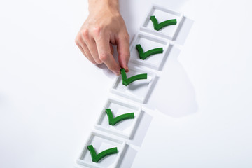 Man Hand Placing Check Mark In Box