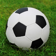 Fototapeta na wymiar soccer ball on the field with green grass. football, sport.