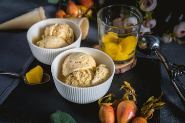 Homemade ice cream with mango on rustic background