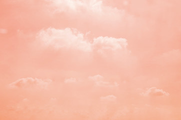 Pink sky with white clouds with blurred pattern background