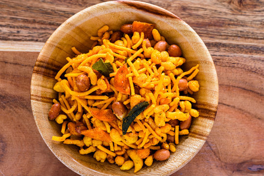 Srilankan style spicy snack mixture in a wooden bowl.
