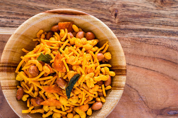 Srilankan style spicy snack mixture in a wooden bowl.