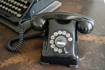 Old typewriter and telephone