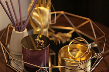 Composition with stylish accessories and interior elements on table, closeup