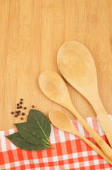 Cooking concept with tablecloth and wooden spoon