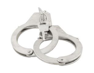 Handcuffs with keys isolated on white background