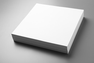 Stack of blank paper sheets for brochure on grey background. Mock up