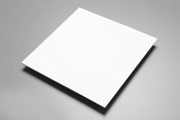 Blank paper sheets for brochure on grey background. Mock up