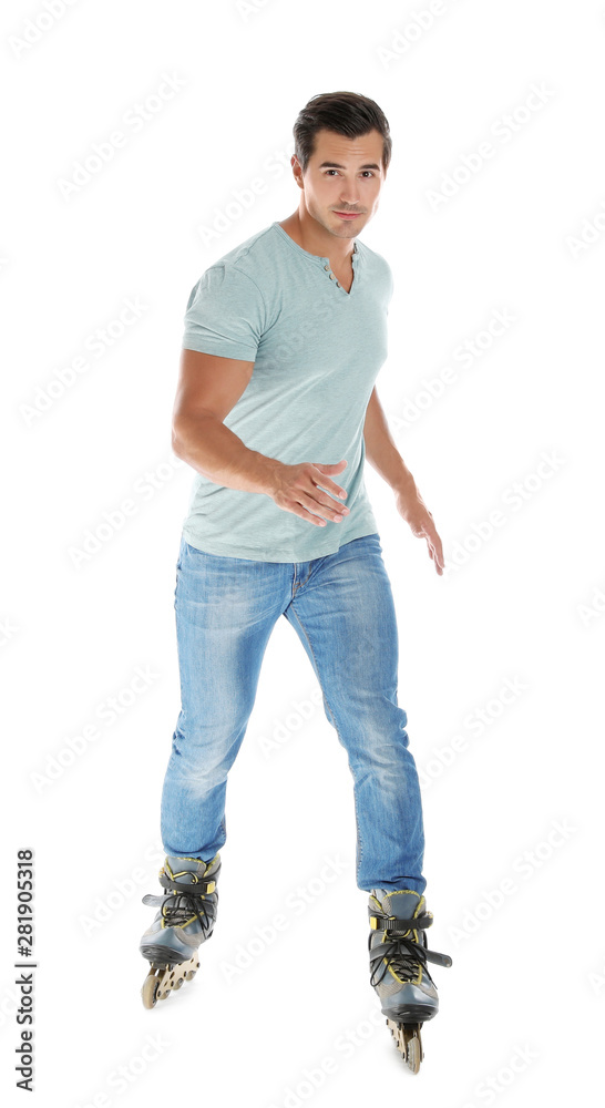 Canvas Prints Handsome young man with inline roller skates on white background