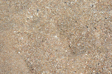 Texture of sand on the beach close up. Natural abstract background