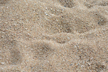 Texture of sand on the beach close up. Natural abstract background