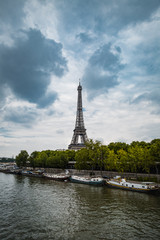 Fototapeta na wymiar Eiffel Tower in Paris in front of a Moody sky