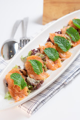 Salmon spicy with vegetable and herb,Thai style on white background