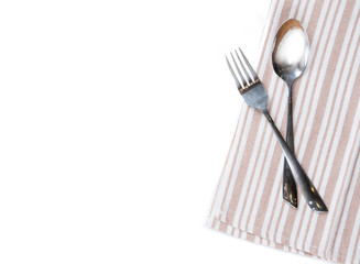 Checkered tablecloth with fork and spoon on white background
